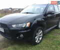 Черный Мицубиси Аутлендер, объемом двигателя 2.36 л и пробегом 315 тыс. км за 9700 $, фото 1 на Automoto.ua