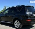 Черный Мицубиси Аутлендер, объемом двигателя 2.36 л и пробегом 244 тыс. км за 9000 $, фото 1 на Automoto.ua