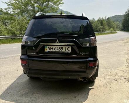 Черный Мицубиси Аутлендер, объемом двигателя 2.4 л и пробегом 275 тыс. км за 12000 $, фото 4 на Automoto.ua