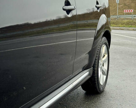 Чорний Міцубісі Аутлендер, об'ємом двигуна 2 л та пробігом 228 тис. км за 10550 $, фото 9 на Automoto.ua