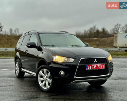 Чорний Міцубісі Аутлендер, об'ємом двигуна 2 л та пробігом 228 тис. км за 10550 $, фото 44 на Automoto.ua
