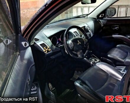 Черный Мицубиси Аутлендер, объемом двигателя 2.4 л и пробегом 70 тыс. км за 10500 $, фото 6 на Automoto.ua