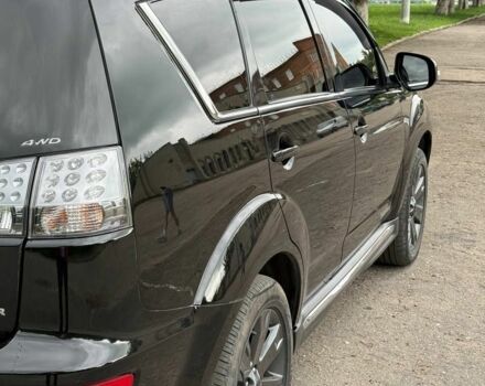 Чорний Міцубісі Аутлендер, об'ємом двигуна 2 л та пробігом 210 тис. км за 10700 $, фото 1 на Automoto.ua