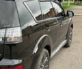 Чорний Міцубісі Аутлендер, об'ємом двигуна 2 л та пробігом 210 тис. км за 10700 $, фото 1 на Automoto.ua