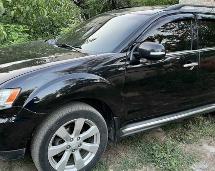 Черный Мицубиси Аутлендер, объемом двигателя 2.4 л и пробегом 220 тыс. км за 10500 $, фото 2 на Automoto.ua