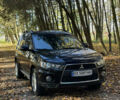 Міцубісі Аутлендер 2011 у Хмельницькому на Automoto.ua Чорний Міцубісі Аутлендер, об'ємом двигуна 2 л та пробігом 196 тис. км за 9500 $, фото 1 на Automoto.ua