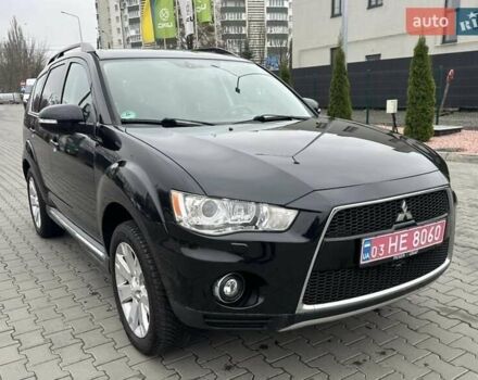 Черный Мицубиси Аутлендер, объемом двигателя 2.2 л и пробегом 226 тыс. км за 10750 $, фото 1 на Automoto.ua