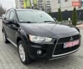 Черный Мицубиси Аутлендер, объемом двигателя 2.2 л и пробегом 226 тыс. км за 10750 $, фото 1 на Automoto.ua