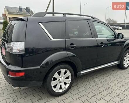 Черный Мицубиси Аутлендер, объемом двигателя 2.2 л и пробегом 226 тыс. км за 10750 $, фото 24 на Automoto.ua