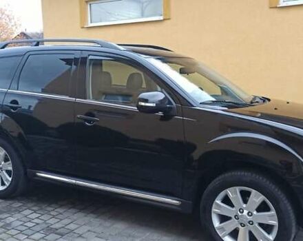 Черный Мицубиси Аутлендер, объемом двигателя 2.2 л и пробегом 209 тыс. км за 12700 $, фото 4 на Automoto.ua