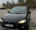 Черный Мицубиси Аутлендер, объемом двигателя 2.2 л и пробегом 253 тыс. км за 12500 $, фото 1 на Automoto.ua