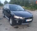 Черный Мицубиси Аутлендер, объемом двигателя 2.3 л и пробегом 255 тыс. км за 11200 $, фото 1 на Automoto.ua