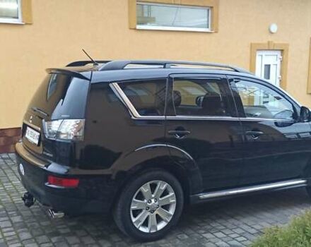 Черный Мицубиси Аутлендер, объемом двигателя 2.2 л и пробегом 209 тыс. км за 12700 $, фото 3 на Automoto.ua