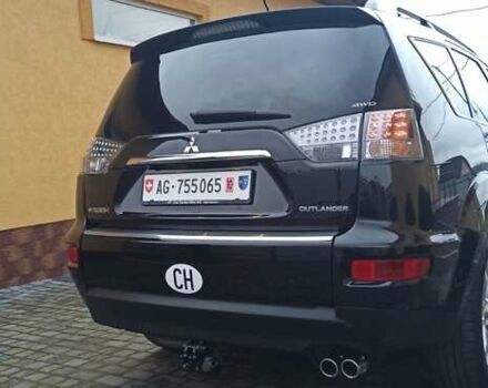 Черный Мицубиси Аутлендер, объемом двигателя 2.2 л и пробегом 209 тыс. км за 12700 $, фото 1 на Automoto.ua