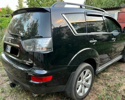 Черный Мицубиси Аутлендер, объемом двигателя 2.4 л и пробегом 220 тыс. км за 10500 $, фото 4 на Automoto.ua