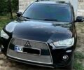 Черный Мицубиси Аутлендер, объемом двигателя 2.4 л и пробегом 220 тыс. км за 10500 $, фото 1 на Automoto.ua