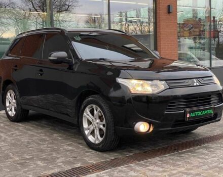 Черный Мицубиси Аутлендер, объемом двигателя 2.4 л и пробегом 212 тыс. км за 12990 $, фото 1 на Automoto.ua