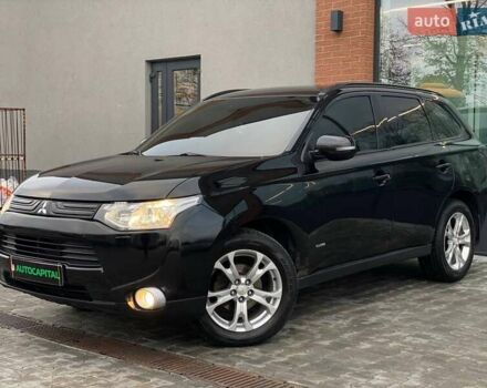 Черный Мицубиси Аутлендер, объемом двигателя 2.36 л и пробегом 212 тыс. км за 12990 $, фото 1 на Automoto.ua