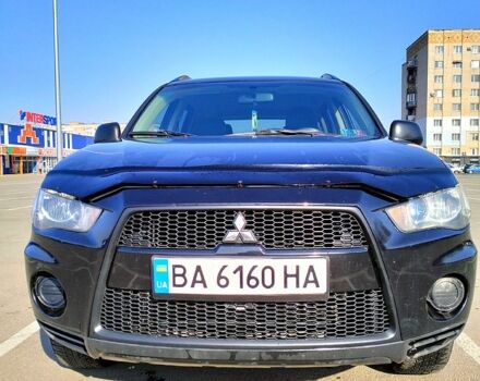 Черный Мицубиси Аутлендер, объемом двигателя 2.4 л и пробегом 140 тыс. км за 10500 $, фото 1 на Automoto.ua