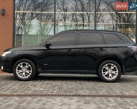 Черный Мицубиси Аутлендер, объемом двигателя 2.36 л и пробегом 212 тыс. км за 12990 $, фото 4 на Automoto.ua