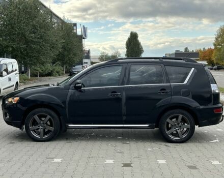 Черный Мицубиси Аутлендер, объемом двигателя 2 л и пробегом 250 тыс. км за 4850 $, фото 1 на Automoto.ua