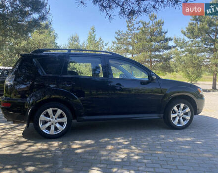 Черный Мицубиси Аутлендер, объемом двигателя 2.36 л и пробегом 155 тыс. км за 9000 $, фото 1 на Automoto.ua