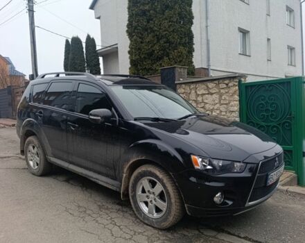 Черный Мицубиси Аутлендер, объемом двигателя 2 л и пробегом 235 тыс. км за 10300 $, фото 1 на Automoto.ua