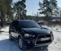 Черный Мицубиси Аутлендер, объемом двигателя 2 л и пробегом 148 тыс. км за 7600 $, фото 1 на Automoto.ua