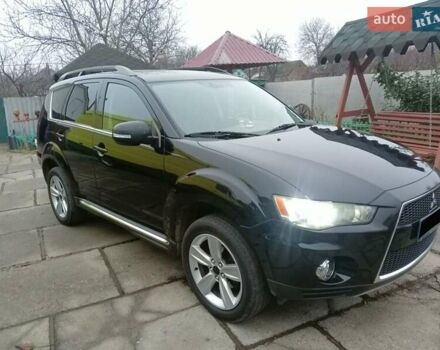 Черный Мицубиси Аутлендер, объемом двигателя 2.2 л и пробегом 218 тыс. км за 11500 $, фото 1 на Automoto.ua