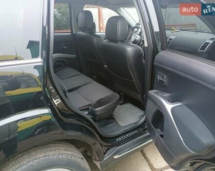 Черный Мицубиси Аутлендер, объемом двигателя 2.2 л и пробегом 218 тыс. км за 11500 $, фото 12 на Automoto.ua