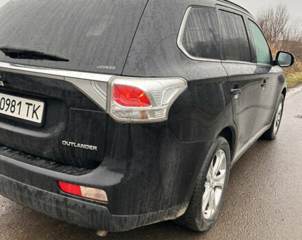 Черный Мицубиси Аутлендер, объемом двигателя 2.27 л и пробегом 202 тыс. км за 13100 $, фото 2 на Automoto.ua
