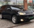 Черный Мицубиси Аутлендер, объемом двигателя 2.36 л и пробегом 212 тыс. км за 12990 $, фото 2 на Automoto.ua