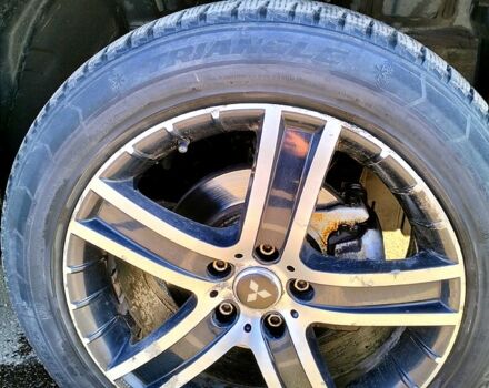 Черный Мицубиси Аутлендер, объемом двигателя 2.4 л и пробегом 140 тыс. км за 10500 $, фото 4 на Automoto.ua