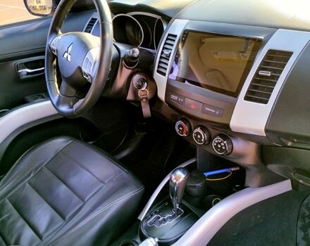 Черный Мицубиси Аутлендер, объемом двигателя 2.4 л и пробегом 140 тыс. км за 10500 $, фото 5 на Automoto.ua