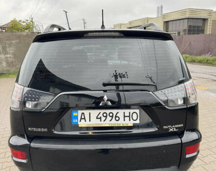 Чорний Міцубісі Аутлендер, об'ємом двигуна 2.36 л та пробігом 96 тис. км за 11700 $, фото 3 на Automoto.ua