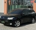 Черный Мицубиси Аутлендер, объемом двигателя 2.36 л и пробегом 212 тыс. км за 11490 $, фото 1 на Automoto.ua