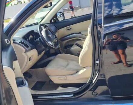 Черный Мицубиси Аутлендер, объемом двигателя 2.27 л и пробегом 195 тыс. км за 10500 $, фото 9 на Automoto.ua