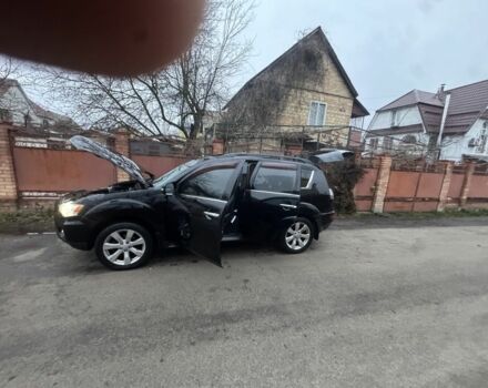 Черный Мицубиси Аутлендер, объемом двигателя 2.4 л и пробегом 136 тыс. км за 14500 $, фото 1 на Automoto.ua