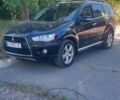 Чорний Міцубісі Аутлендер, об'ємом двигуна 2.4 л та пробігом 135 тис. км за 12399 $, фото 1 на Automoto.ua