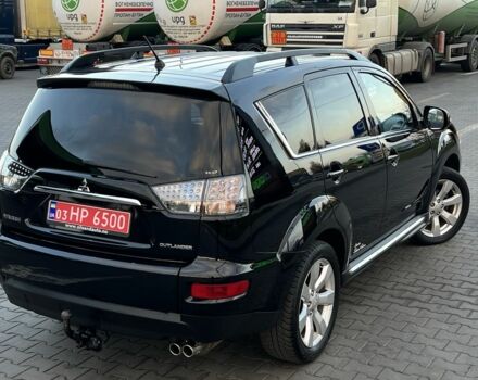 Черный Мицубиси Аутлендер, объемом двигателя 2.3 л и пробегом 124 тыс. км за 11999 $, фото 1 на Automoto.ua