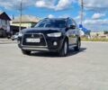 Черный Мицубиси Аутлендер, объемом двигателя 2.27 л и пробегом 195 тыс. км за 10500 $, фото 1 на Automoto.ua