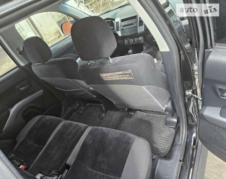 Чорний Міцубісі Аутлендер, об'ємом двигуна 2.36 л та пробігом 164 тис. км за 10800 $, фото 8 на Automoto.ua