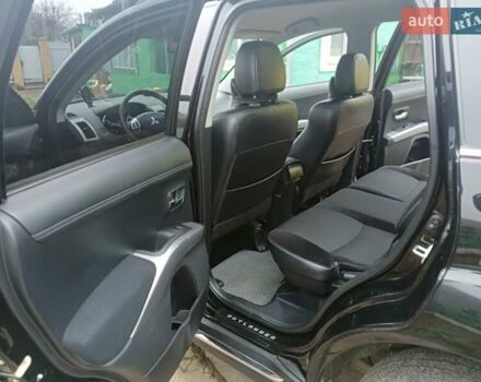 Черный Мицубиси Аутлендер, объемом двигателя 2.2 л и пробегом 218 тыс. км за 11500 $, фото 16 на Automoto.ua