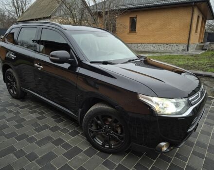 Черный Мицубиси Аутлендер, объемом двигателя 2.4 л и пробегом 211 тыс. км за 12590 $, фото 2 на Automoto.ua