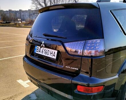 Черный Мицубиси Аутлендер, объемом двигателя 2.4 л и пробегом 140 тыс. км за 10500 $, фото 2 на Automoto.ua