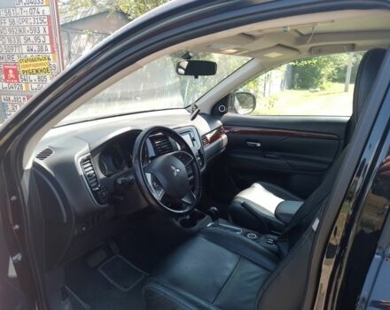 Черный Мицубиси Аутлендер, объемом двигателя 2.4 л и пробегом 300 тыс. км за 11000 $, фото 2 на Automoto.ua