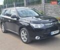 Черный Мицубиси Аутлендер, объемом двигателя 2.36 л и пробегом 156 тыс. км за 13750 $, фото 1 на Automoto.ua