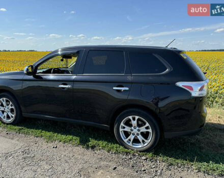 Черный Мицубиси Аутлендер, объемом двигателя 2.4 л и пробегом 150 тыс. км за 13700 $, фото 2 на Automoto.ua