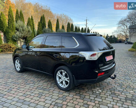Черный Мицубиси Аутлендер, объемом двигателя 2 л и пробегом 190 тыс. км за 12500 $, фото 2 на Automoto.ua