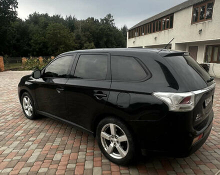 Черный Мицубиси Аутлендер, объемом двигателя 2.36 л и пробегом 70 тыс. км за 9000 $, фото 6 на Automoto.ua